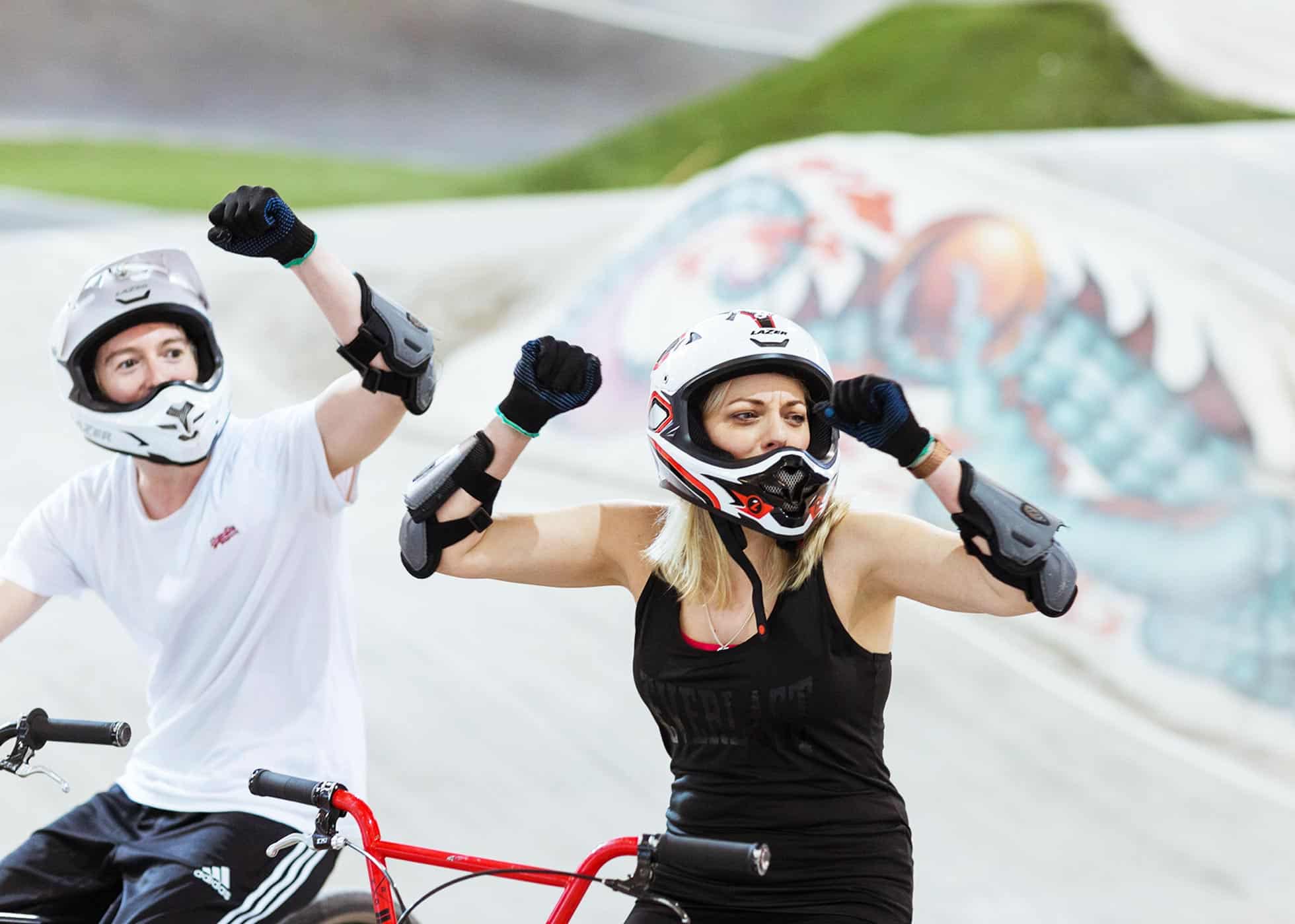 Male & Female Riding BMX Bikes At The National Cycling Centre