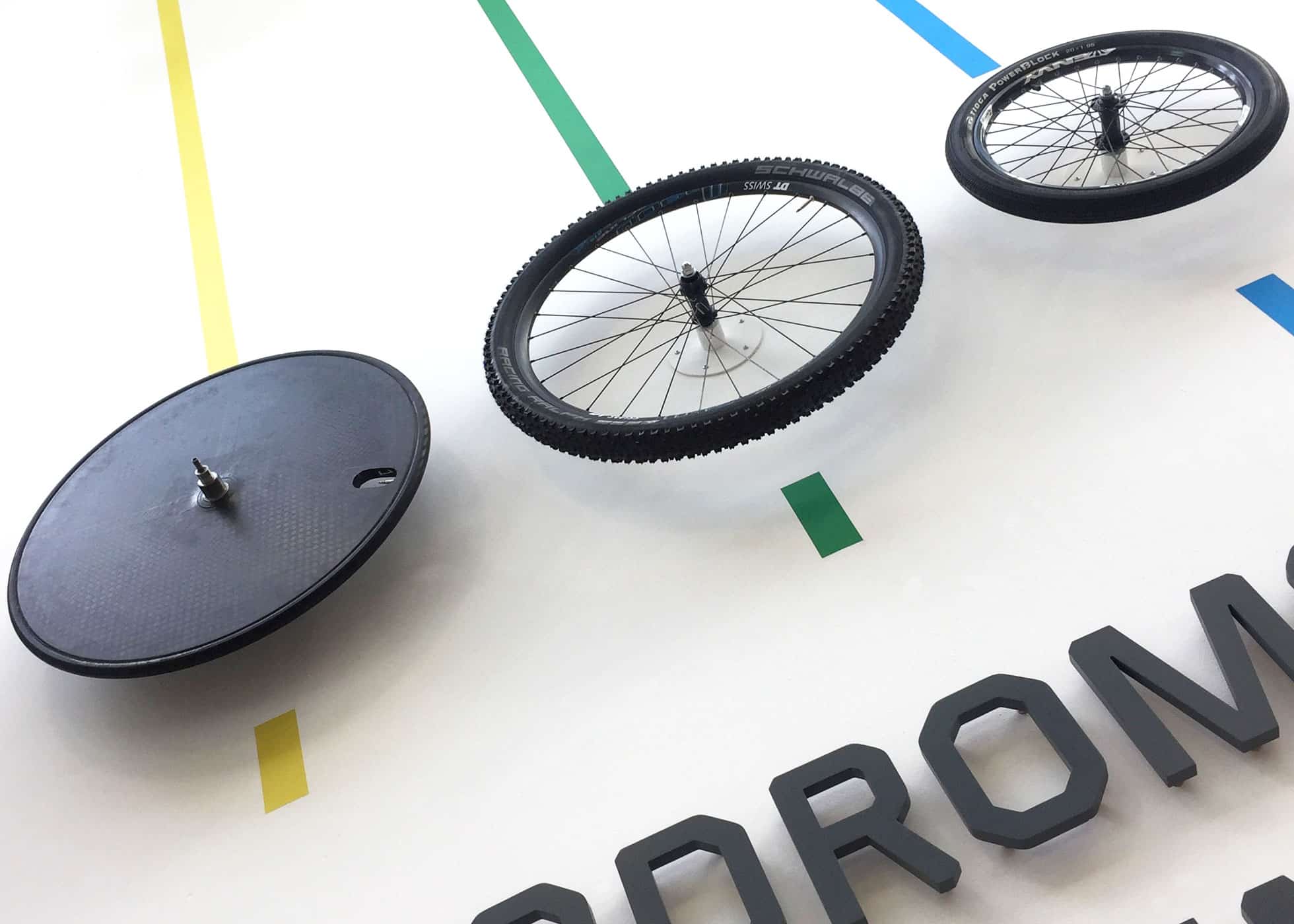 A close look at Velodrome Sign With Mountain Bike & BMX Wheels On Wall