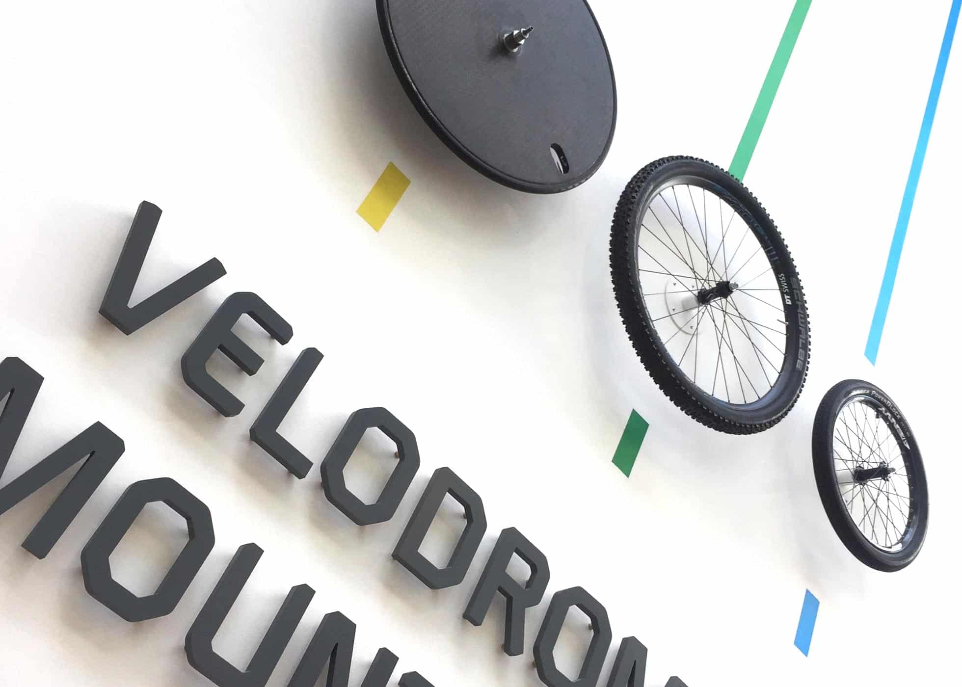 Velodrome Sign With Mountain Bike & BMX Wheels On Wall